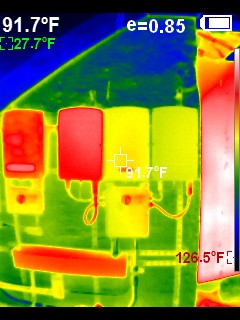 Infrared thermal image of an electrical disconnect and enclosures reading 91.7°F against a cooler blue background
