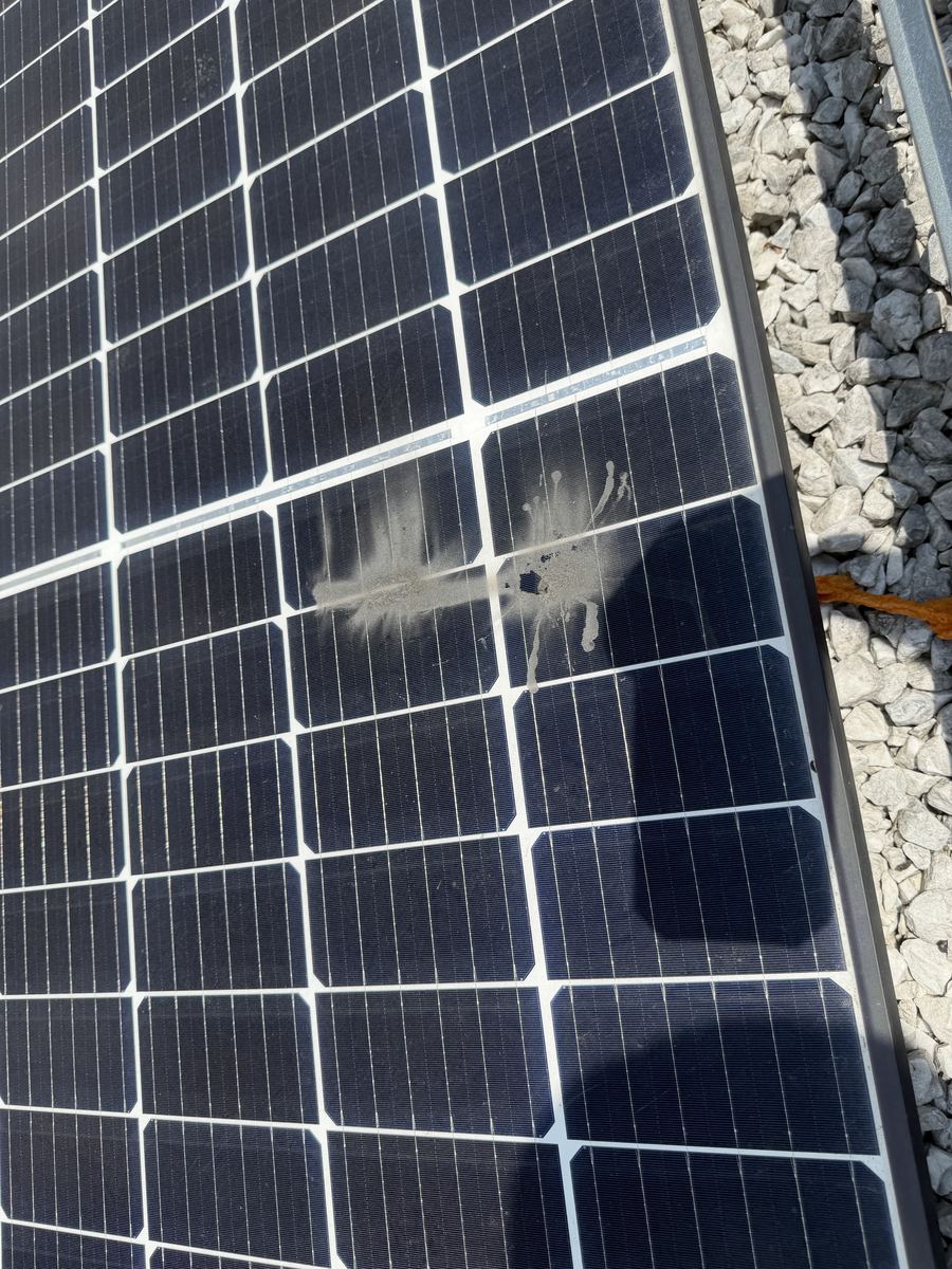 Bird dropping residue on a solar panel surface, a localized hot-spot risk